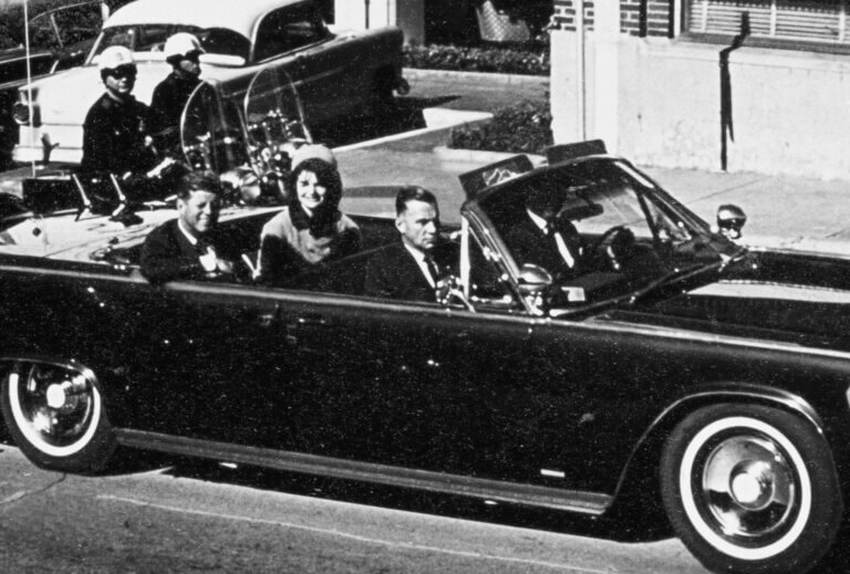 Historic car ride with notable passengers.