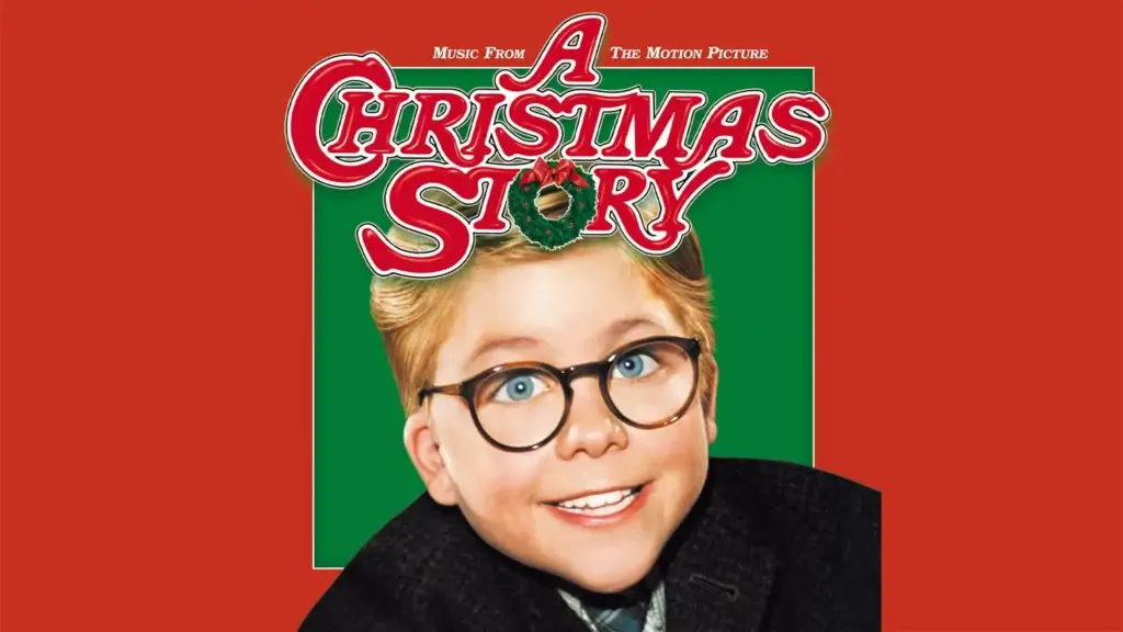 Boy with glasses smiling for Christmas movie.